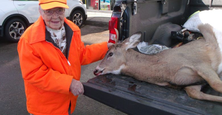 Florence Teeters stands with her first buck on her first hunt at age 104.