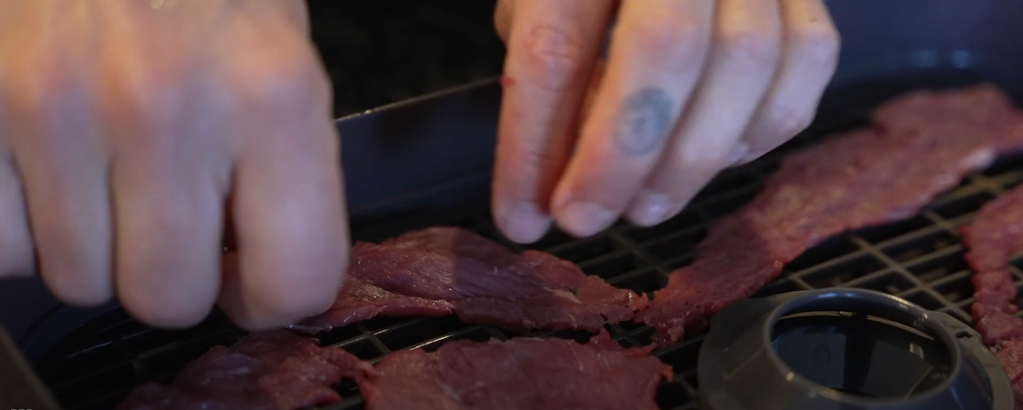 cutting meat into thin strips